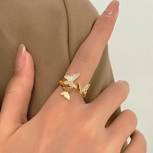 Elegant gold butterfly ring with sparkling zircons in a layered flying wing design