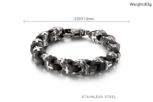 Detail view of vintage stainless steel biker chain bracelet with cross relief texture