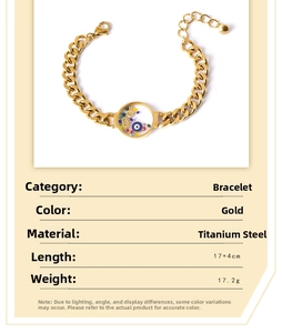 Detail of bohemian gold stainless steel chain bracelet with evil eye pendant and stone
