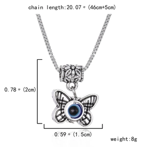 Detailed macro view of butterfly evil eye pendant with box chain dimensions and weight