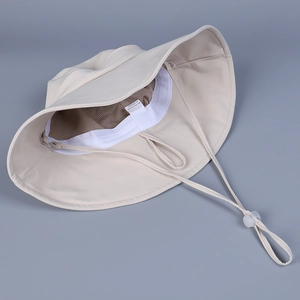 Detail of sun hat interior featuring breathable mesh lining and adjustable chin strap