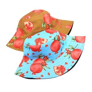 Reversible bucket hat with pomegranate pattern in light blue and khaki colors