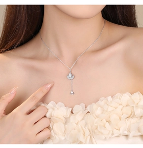 Elegant s925 silver ginkgo leaf necklace with zircon fringe worn on a model's neck