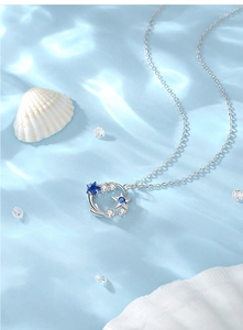 Detail of S925 sterling silver ocean starry sky necklace with blue zircons and shells