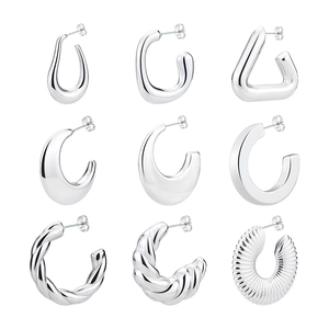 Set of 9 minimalist geometric silver hoop earrings with spiral and polished textures