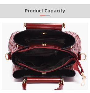 Top view of burgundy woven tote showing interior multi-compartment capacity and gold hardware
