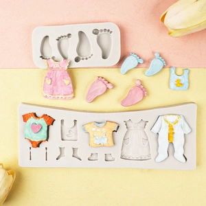 Detailed silicone mold featuring baby themed shapes like baby clothes and bottles for baking