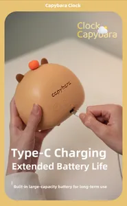 Detail view of Capybara smart alarm clock showing Type-C charging port and setting buttons