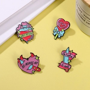 Pink heart knife and love potion enamel pins set on yellow background for clothes