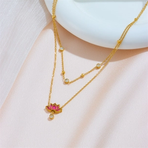 Detailed shot of double-layered gold snake chain with pink lotus flower pendant