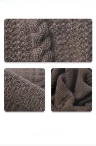 Detail display of dark brown cable knit wool fabric with honeycomb weave texture