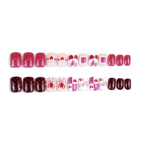 Short square press-on nails with sweet Valentine heart and polka dot cherry designs