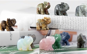 Detailed collection of small natural crystal elephant carvings in diverse gemstones