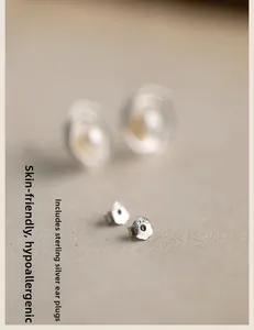 Detailed macro view showing S925 sterling silver hallmarked earring backs for women