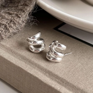 S925 sterling silver twist hoop earrings with a minimalist wavy design for women
