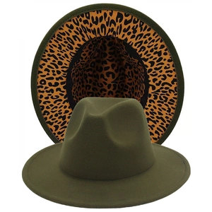 Detail of olive green wool fedora hat featuring classic leopard print lining and wide brim