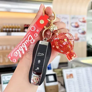Red hot air balloon quicksand keychain with liquid glitter and golden bell