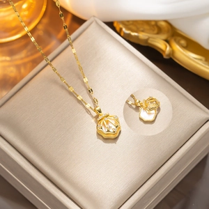 Double-layered golden shell locket necklace with zircon inlay and pearlescent interior