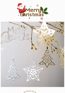 Detailed view of gold and silver metal Christmas ornaments hanging on a branch