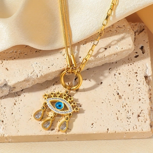 Double-layered gold evil eye necklace with blue zircons and star waterdrop pendants