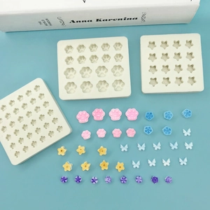 Mini silicone molds featuring cat paw and butterfly shapes for resin DIY handmade projects