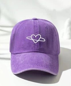Close-up of vintage washed purple baseball cap with white heart embroidery details