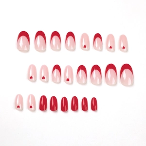 Minimalist French red heart press-on nails set with almond shape on white background