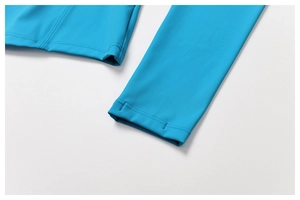Detail of royal blue sportswear showing double-needle stitching on elastic fabric hem