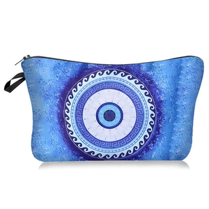 Detail of waterproof evil eye makeup bag showing blue mandala pattern and black zipper