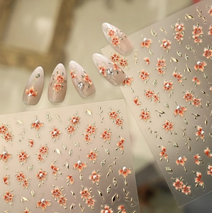 Detailed 5D relief nail stickers featuring red flowers, pearls, and gold accents
