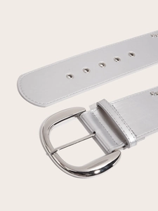Detail of vintage silver PU leather belt featuring hollow rings and metal studs