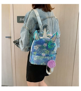 Kid's blue sequin unicorn backpack with silver glitter horn and purple pom-pom detail