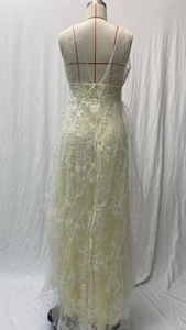 Close-up of elegant V-neck lace wedding dress featuring intricate floral embroidery and sequins
