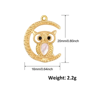 Gold owl on crescent moon charm with pearl belly and size markings of 20mm x 16mm