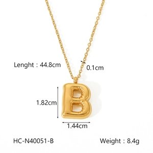 Detailed view showing dimensions of golden bubble letter B pendant on a thin metal chain