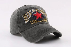 Detailed embroidery of Hilarity text and red star on washed grey baseball cap
