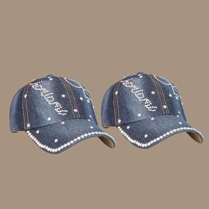 Deep blue denim baseball cap with sparkling rhinestones and orange contrast stitching