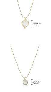 Close-up of heart and square white shell pendants on beaded gold chain necklaces