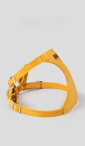 Detail view of ginger suede dog harness with premium metal buckle and leather brand tag