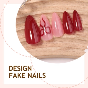 French almond fake nails with deep red patterns and hand-painted bow designs