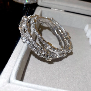 Close-up of sparkling multi-layer silver bangle with cubic zirconia on a jewelry box