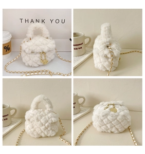 Close-up of cream white plush cylinder bag with quilted texture and gold camellia charm