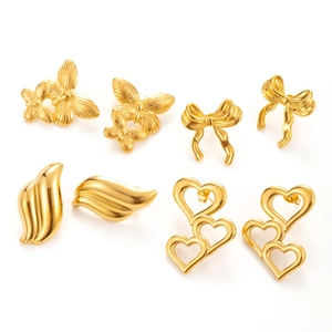 Golden titanium steel earring set with butterfly, bow, and heart shapes on white background