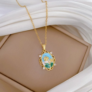 Detailed close-up of gold enamel tulip pendant necklace with gems on brown jewelry box