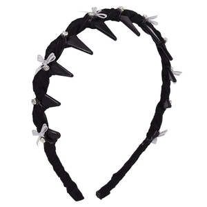 Ballet style headband with black spikes, rhinestones and silver bows on dark fabric