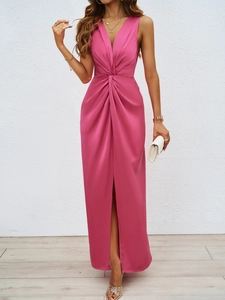 Detail of elegant dark pink sleeveless dress showing sophisticated waist knot and side slit