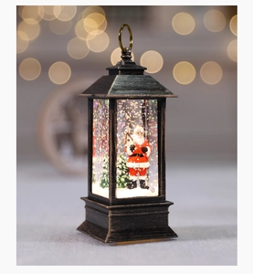 Macro detail of bronze Christmas lantern with Santa Claus and sparkling liquid glitter