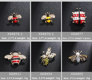 Detail view of mini insect brooches with size and weight specs for bee and ladybug pins