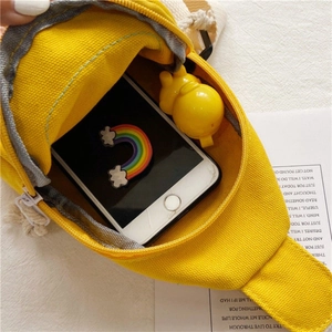 Yellow mini canvas crossbody bag for girls showing spacious internal phone storage space
