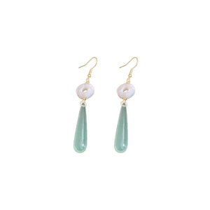 Modern gold earrings with white donut bead and long green resin teardrop pendant
